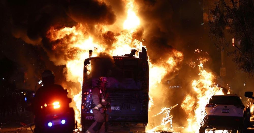 Rowdy crowd in Los Angeles lights bus on fire and breaks into stores in celebration of Dodgers win