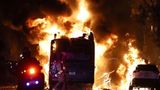 Rowdy crowd in Los Angeles lights bus on fire and breaks into stores in celebration of Dodgers win