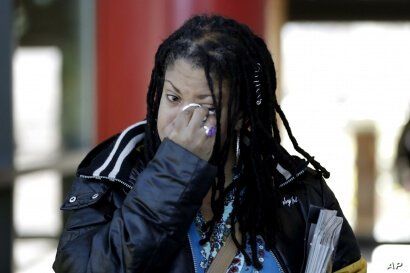 Katrina Hutton wipes tears as she leaves Gilliam Concert Hall after viewing the open casket of U.S. Rep. Elijah Cummings at…