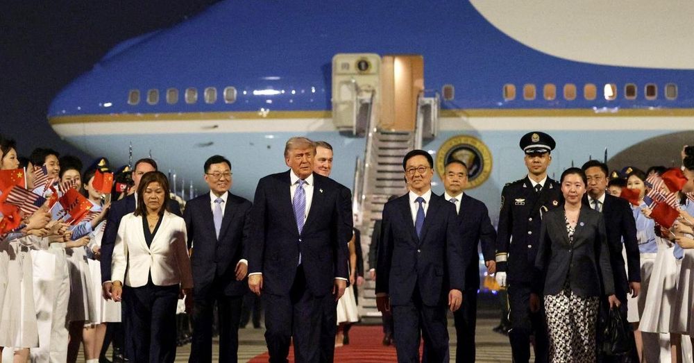 Trump arrives in Beijing to red carpet welcome including military honor guard and band