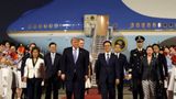 Trump arrives in Beijing to red carpet welcome including military honor guard and band