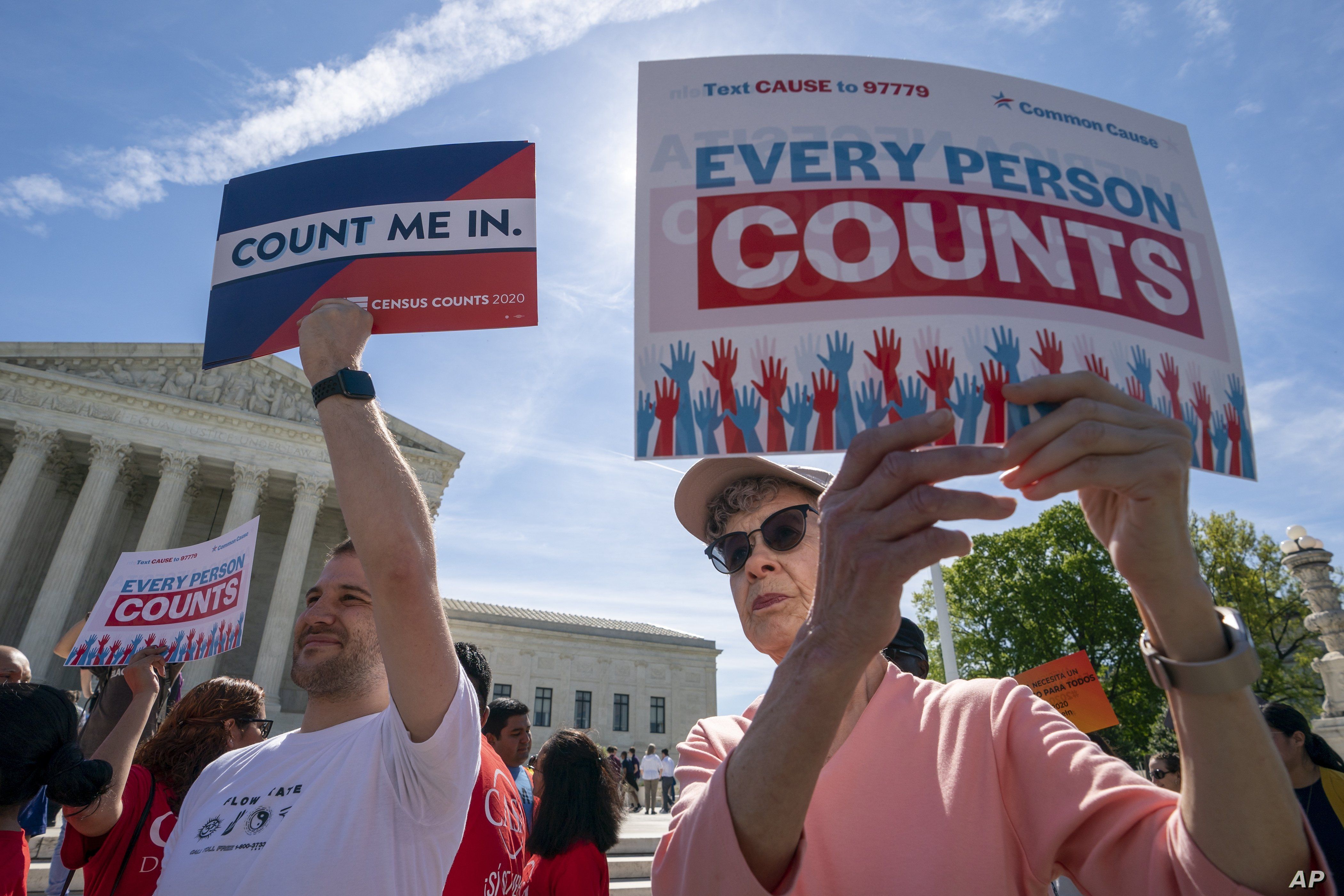 Immigration activists rally outside the Supreme Court as the justices hear arguments over the Trump administration's plan to ask about citizenship on the 2020 census, in Washington, April 23, 2019.