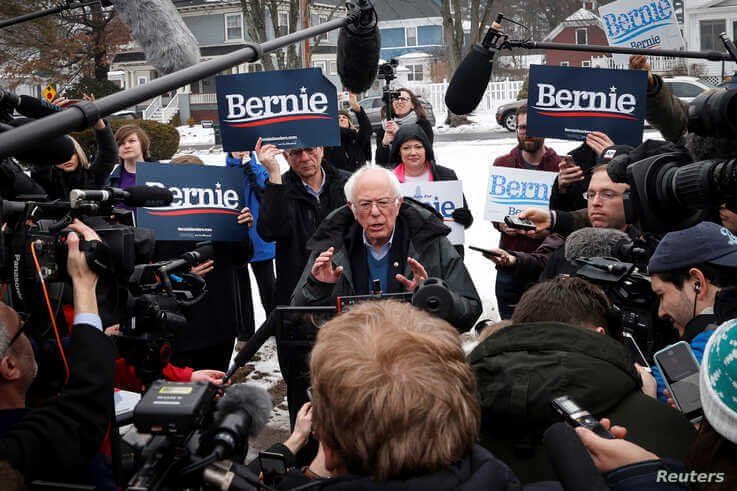 Democratic U.S. presidential candidate Senator Bernie Sanders speaks to the media at a polling station at the McDonough School…