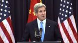 Tearful John Kerry says wife is improving