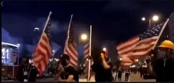 Protesters in Hong Kong Waving the American Flag