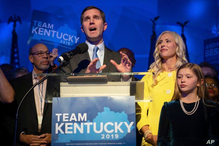 Kentucky Attorney General and democratic Gubernatorial Candidate Andy Beshear stands with his wife, Britainy as he delivers a…