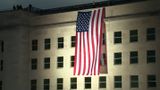 September 11 Marked with Flag Unfurling from Pentagon