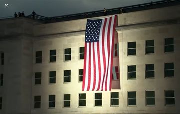 September 11 Marked with Flag Unfurling from Pentagon