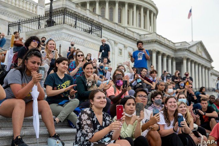 Crowds that attended a sit-in at Capitol Hill listen to Rep. Cori Bush, D-Mo., after it was announced that the Biden…