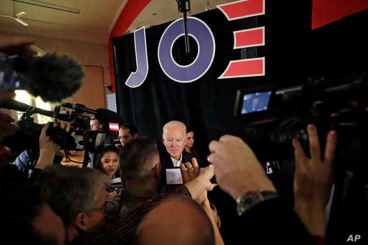 Democratic presidential candidate former Vice President Joe Biden is surrounded at a campaign event, Wednesday, Feb. 5, 2020,…