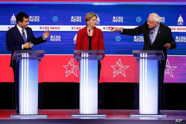 From left, Democratic presidential candidates, former South Bend Mayor Pete Buttigieg, Sen. Elizabeth Warren, D-Mass., and Sen…