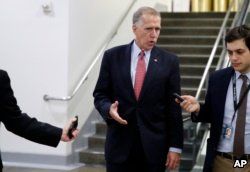 Sen. Thom Tillis, R-N.C., talks with reporters as he departs after a vote to confiirm Gina Haspel as CIA director, on Capitol Hill, May 17, 2018 in Washington.
