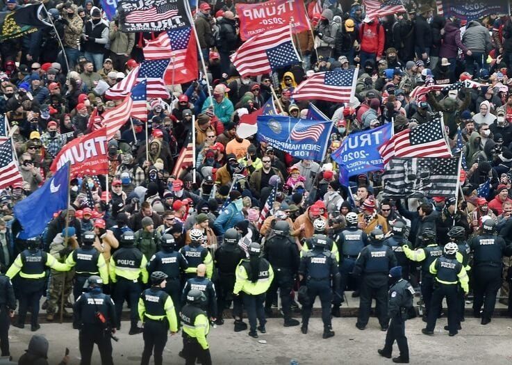 Trump supporters clash with police and security forces as they storm the US Capitol in Washington, DC on January 6, 2021. -…