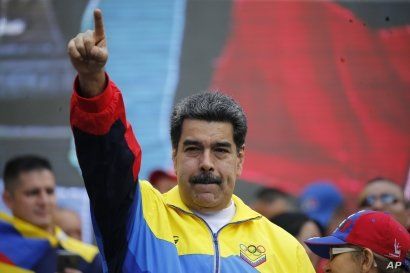 Venezuela's President Nicolas Maduro leads a rally condemning U.S. economic sanctions imposed on Venezuela, in Caracas, Aug. 10, 2019. 