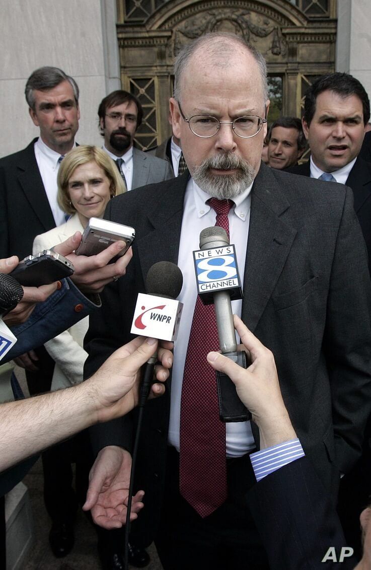 FILE - In this April 25, 2006, file photo, John Durham speaks to reporters on the steps of U.S. District Court in New Haven,…