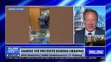 MARINE VET PROTESTS DURING HEARING