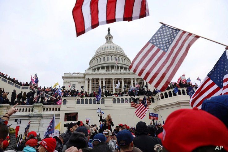 FILE - Supporters of President Donald Trump gather outside the U.S. Capitol in Washington, D.C., Jan. 6, 2021.
