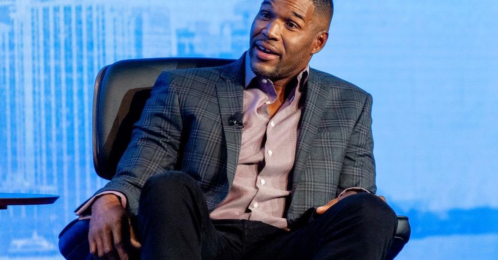 Michael Strahan says he was not protesting when he didn't put hand on heart during national anthem