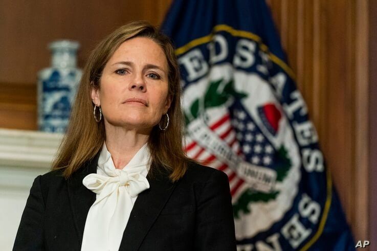 Supreme Court nominee Judge Amy Coney Barrett listens as Sen. Jerry Moran, R-Ks., not shown, speaks during their meeting on…