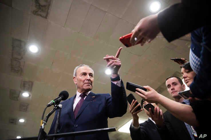 Senate Democratic Minority Leader Chuck Schumer speaks to the media after leaving the Senate chamber on Capitol Hill in Washington, Feb. 3, 2020.