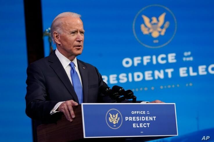 FILE - President-elect Joe Biden speaks after the Electoral College formally confirmed his election win, at The Queen theater in Wilmington, Delaware, Dec. 14, 2020. 