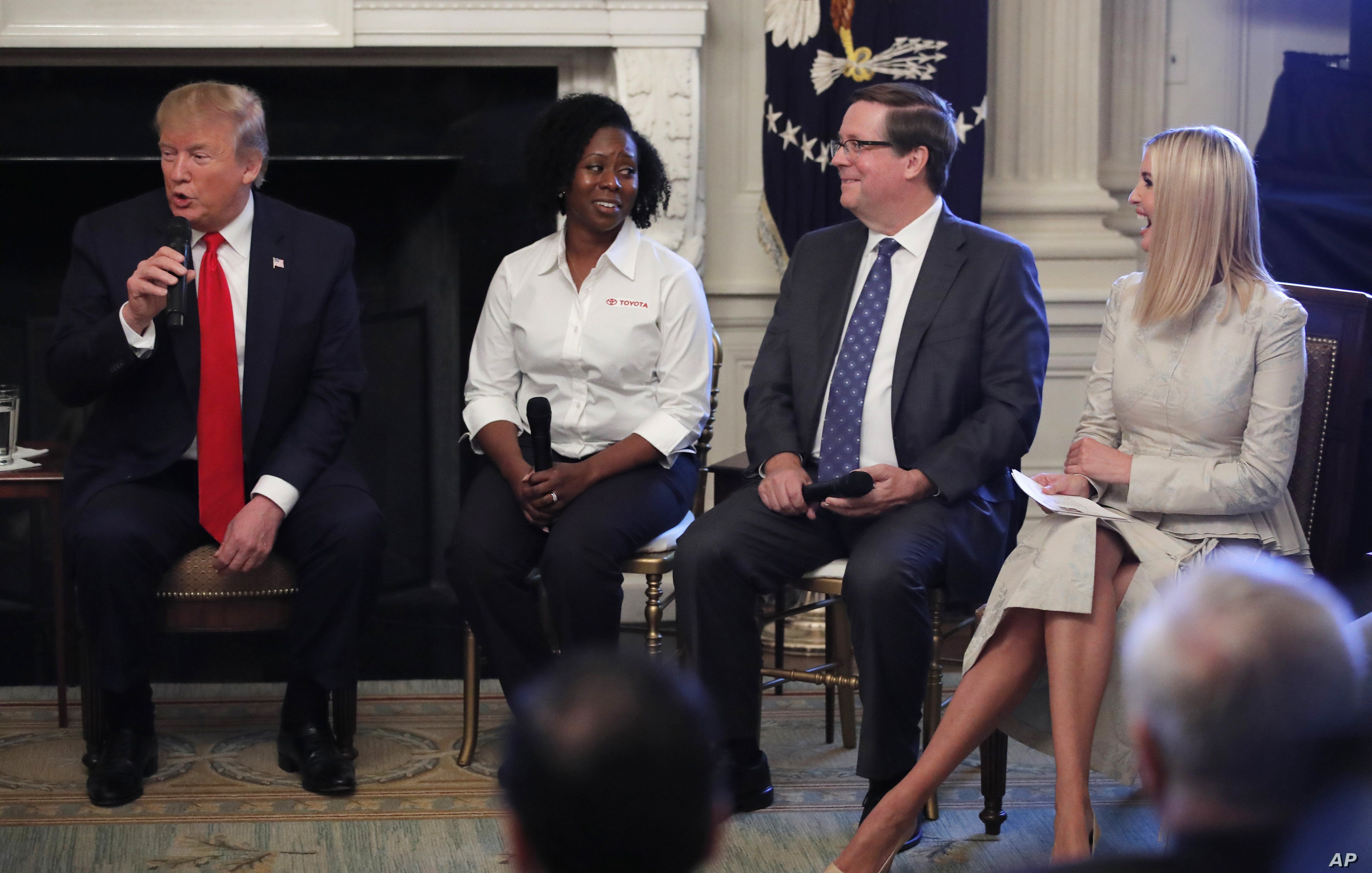 From left, President Donald Trump, joined by Shameka Whaley Green of Toyota, Jim Lentz, CEO of Toyota North America, and his daughter Ivanka Trump speaks during a 