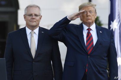 President Donald Trump and Australian Prime Minister Scott Morrison listen to the National Anthem during an State Arrival Ceremony on the South Lawn of the White House in Washington, Friday, Sept. 20, 2019.