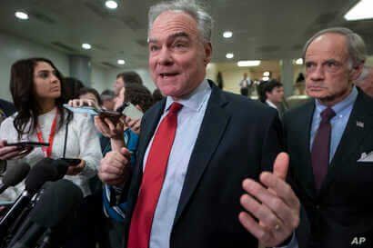 FILE - Democratic Senator Tim Kaine speaks to reporters following a briefing on the details of the threat that prompted the U.S. to kill Iranian Gen. Qassem Soleimani in Iraq, , on Capitol Hill in Washington, Jan. 8, 2020.