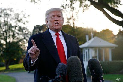 FILE - President Donald Trump speaks to members of the media on the South Lawn of the White House, in Washington, Nov. 4, 2019.