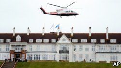 FILE - Then-presidential candidate Donald Trump leaves by his helicopter from the Turnberry golf course in Turnberry, Scotland, Aug. 1, 2015.