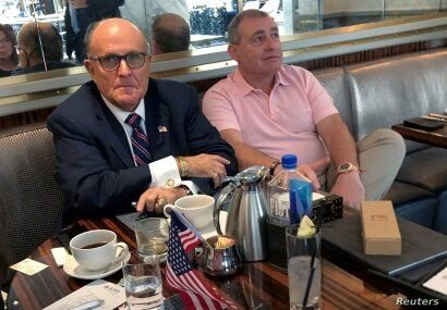 FILE - Rudy Giuliani is seen with Ukrainian-American businessman Lev Parnas at the Trump International Hotel in Washington, Sept. 20, 2019. Parnas has been arrested with another associate of Giuliani's, Igor Fruman, a Belarus-born U.S. citizen.