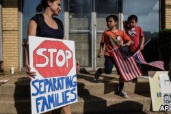 People participate in a protest against recent U.S. immigration policy that separates children from their families when they enter the U.S. as undocumented immigrants, in front of a Homeland Security facility in Elizabeth, New Jersey, June 17, 2018.