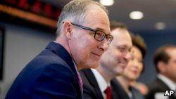 EPA Administrator Scott Pruitt, left, attends a briefing on this year's hurricane season at the Federal Emergency Management Agency Headquarters, June 6, 2018, in Washington.