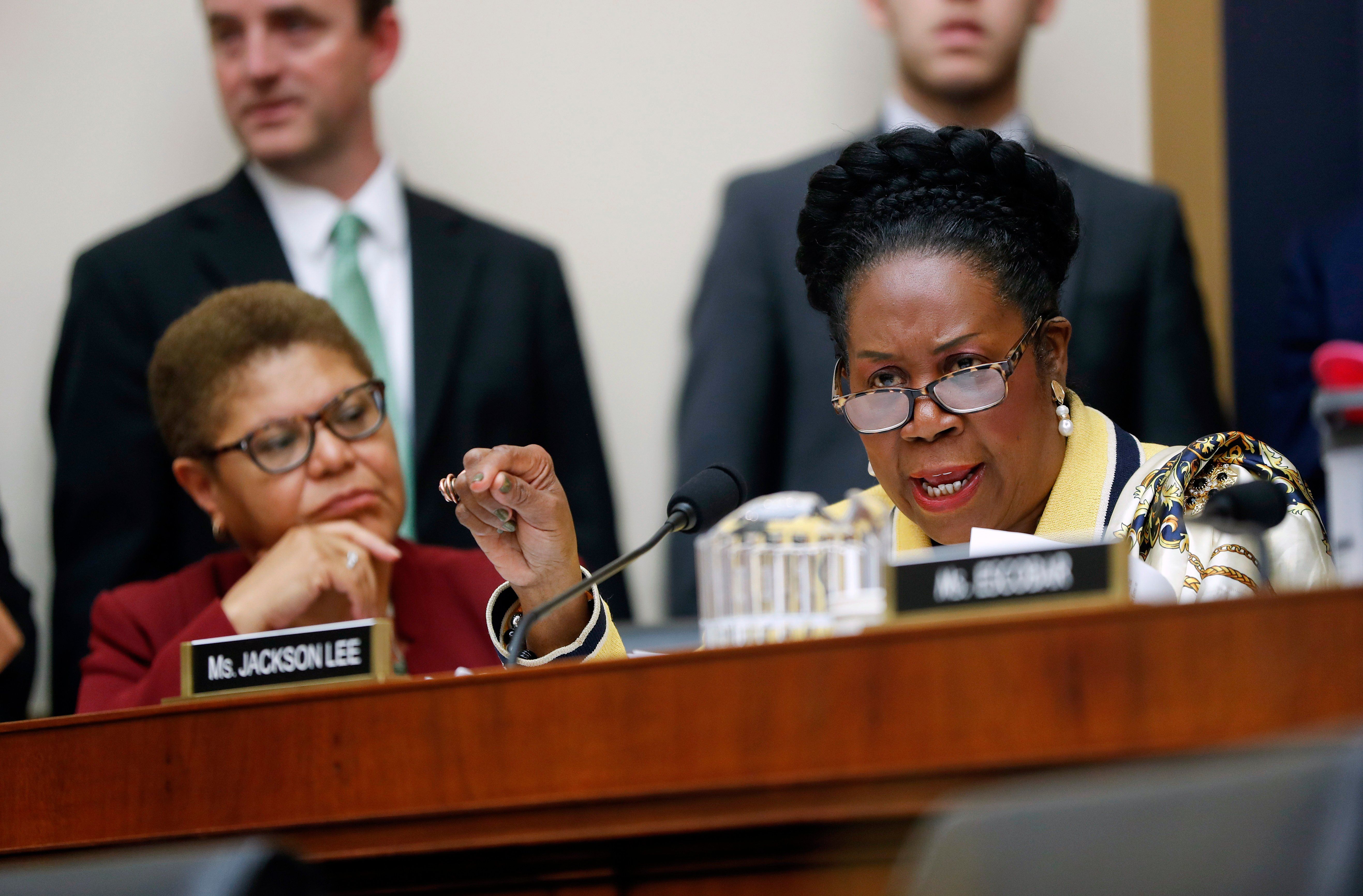 Rep. Sheila Jackson Lee, D-Texas, right, speaks during a hearing about reparation for the descendants of slaves before the House Judiciary Subcommittee on the Constitution, Civil Rights and Civil Liberties, at the Capitol in Washington, Wednesday,…