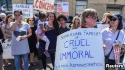 People participate in a protest against recent U.S. immigration policy that separates children from their families when they enter the United States as undocumented immigrants, in front of a Homeland Security facility in Elizabeth, New Jersey, June 17, 2018.