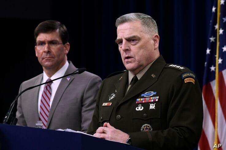 Defense Secretary Mark Esper, left, and Chairman of the Joint Chiefs of Staff Army Gen. Mark Milley, right, during a briefing…