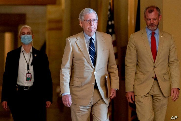 Senate Minority Leader Mitch McConnell of Ky. walks towards the Senate chamber as the $1 trillion bipartisan infrastructure…