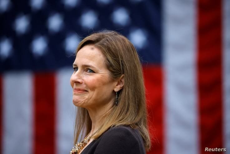 U.S. Court of Appeals for the Seventh Circuit Judge Amy Coney Barrett reacts as U.S President Donald Trump holds an event to…
