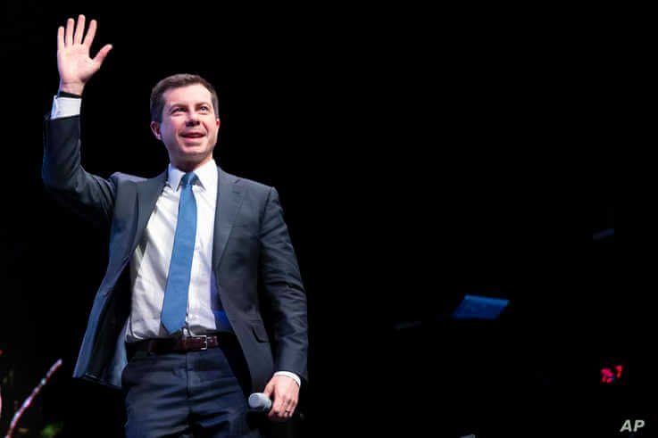 Democratic presidential candidate Pete Buttigieg waves to the crowd during a town hall meeting,  in Concord, New Hampshire, Feb. 5, 2020.