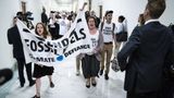 In protest against fossil fuel use, Climate Defiance blocks unused entrance to DOE garage