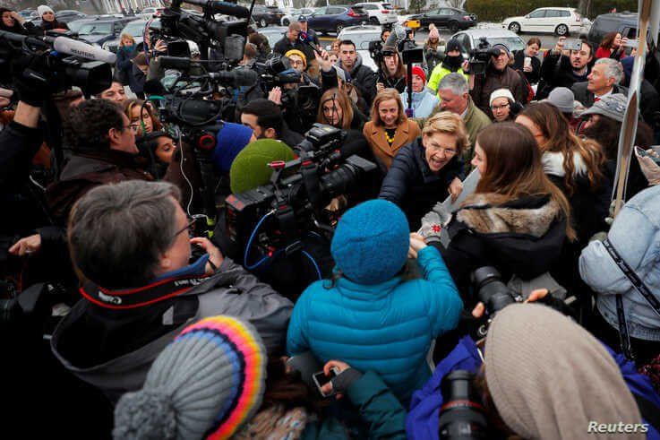 Democratic 2020 U.S. presidential candidate and U.S. Senator Elizabeth Warren (D-MA) greets supporters outside a polling site…