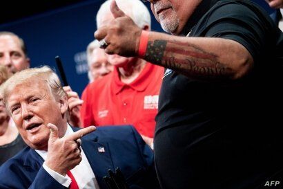 US President Donald Trump speaks after signing an executive order regarding Medicare at Sharon L. Morse Performing Arts Center…