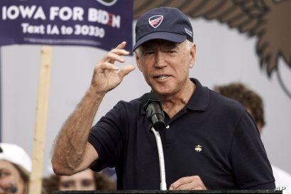 Democratic presidential candidate and former Vice President Joe Biden puts on a Beau Biden Foundation hat while speaking at the Polk County Democrats Steak Fry, in Des Moines, Iowa, Saturday, Sept. 21, 2019. (AP Photo/Nati Harnik)