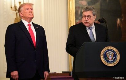 FILE - U.S. President Donald Trump and Attorney General William Barr participate in a ceremony in the East Room of the White House in Washington, Sept. 9, 2019.