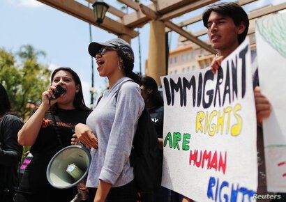 FILE - Protestors demonstrate against the termination of the Deferred Action for Childhood Arrivals (DACA) program outside the 9th Circuit Court of Appeals in Pasadena, California, U.S., May 15, 2018. 