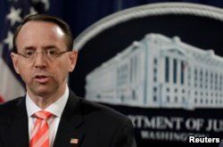FILE - U.S. Deputy Attorney General Rod Rosenstein speaks at a news conference at the Justice Department in Washington, March 23, 2018.