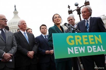 FILE - U.S. Representative Alexandria Ocasio-Cortez (D-NY) and Senator Ed Markey (D-MA) hold a news conference for their proposed Green New Deal to achieve net-zero greenhouse gas emissions in 10 years, at the U.S. Capitol in Washington, Feb. 7, 2019...