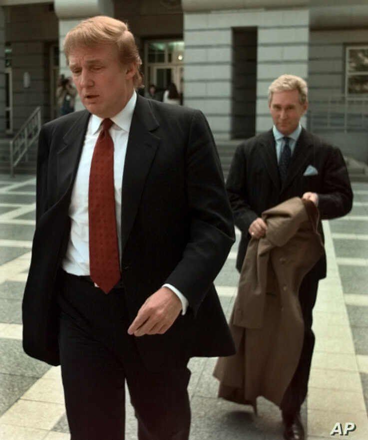 FILE - Billionaire real estate developer Donald Trump, left, walks to the Federal Courthouse in Newark, N.J., with Roger Stone, the director of Trump's presidential exploratory committee, Oct. 25, 1999, for the swearing-in of Trump's sister as a fede...