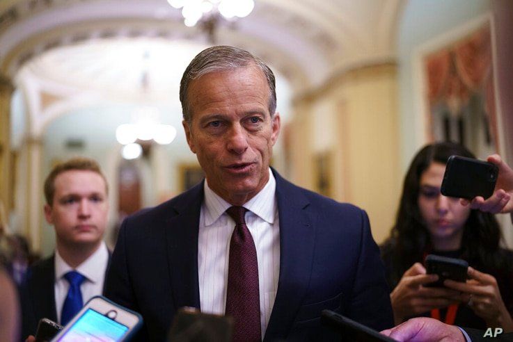 Senate Minority Whip John Thune, R-S.D., speaks to reporters just off the Senate floor as a bipartisan group of lawmakers…