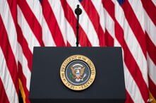FILE - The presidential podium and seal are seen before an event in the South Court Auditorium of the White House complex, in Washington, July 24, 2020. 